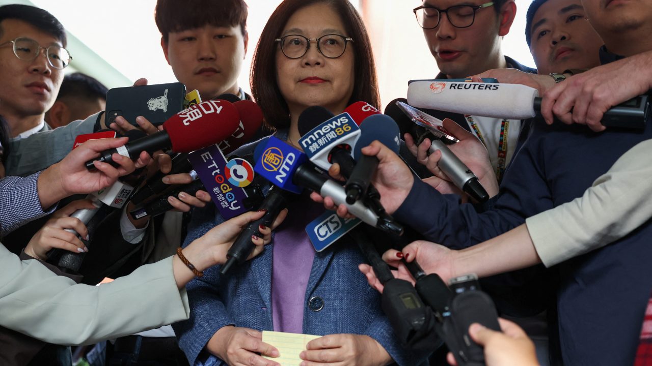 Taiwan s Ocean Affairs Council Minister Kuan Bi ling speaks to the media before entering the parliament in Taipei