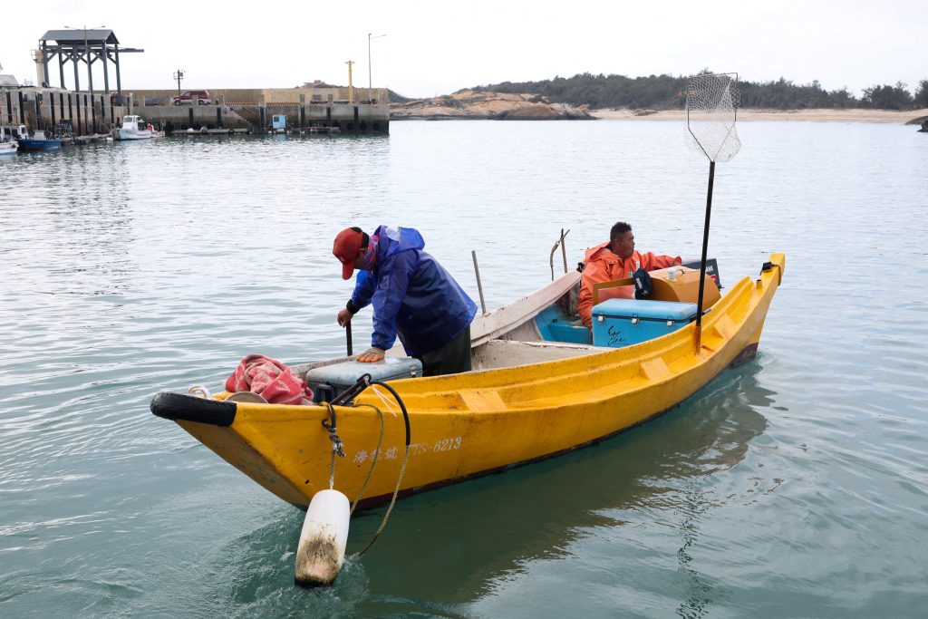 A fishing boat arrives at a port in Kinmen