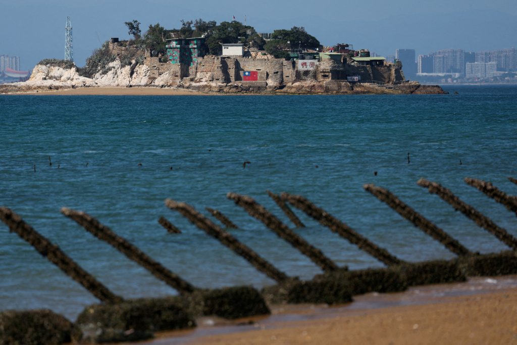 FILE PHOTO: Shiyu or Lion Islet which is part of Kinmen County one of Taiwan s offshore islands is pictured with China s Xiamen in the background in Kinmen