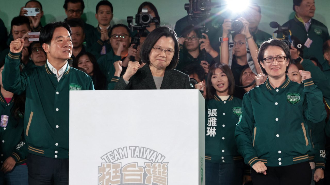Taiwanese President Tsai Ing-wen gestures in between president-elect Lai Ching-te and his running mate, Hsiao Bi-khim, during a rally outside Democratic Progressive Party (DPP) headquarters in Taipei on January 13, after Lai won the presidential election. (Photo: Yasuyoshi Chiba/AFP)