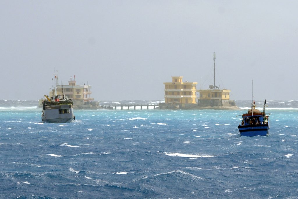 Vietnamese fishing boats are seen near Da Tay island in the Spratly archipelago