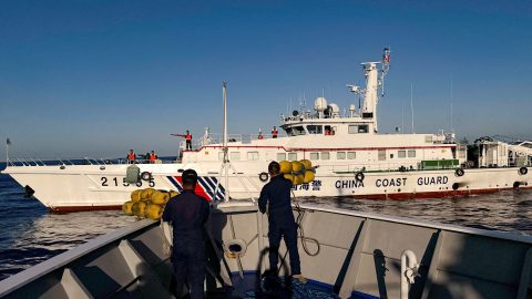 FILE PHOTO: Philippine Coast Guard personnel prepare rubber fenders after Chinese Coast Guard vessels blocked their way to a resupply mission at the Second Thomas Shoal in the South China