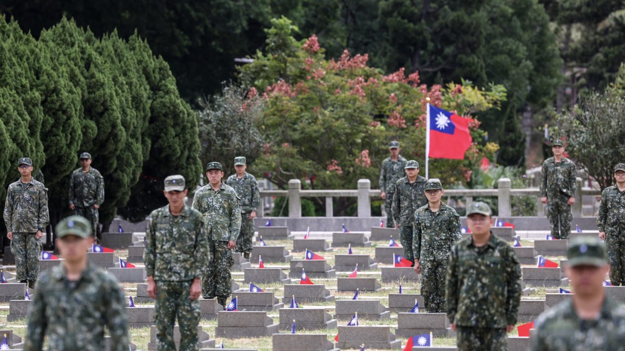Soldiers stand guard at a public cemetery during a ceremony commemorating the 75th anniversary of the Battle of Guningtou in Kinmen on October 25. (Photo: I-Hwa Cheng/AFP)