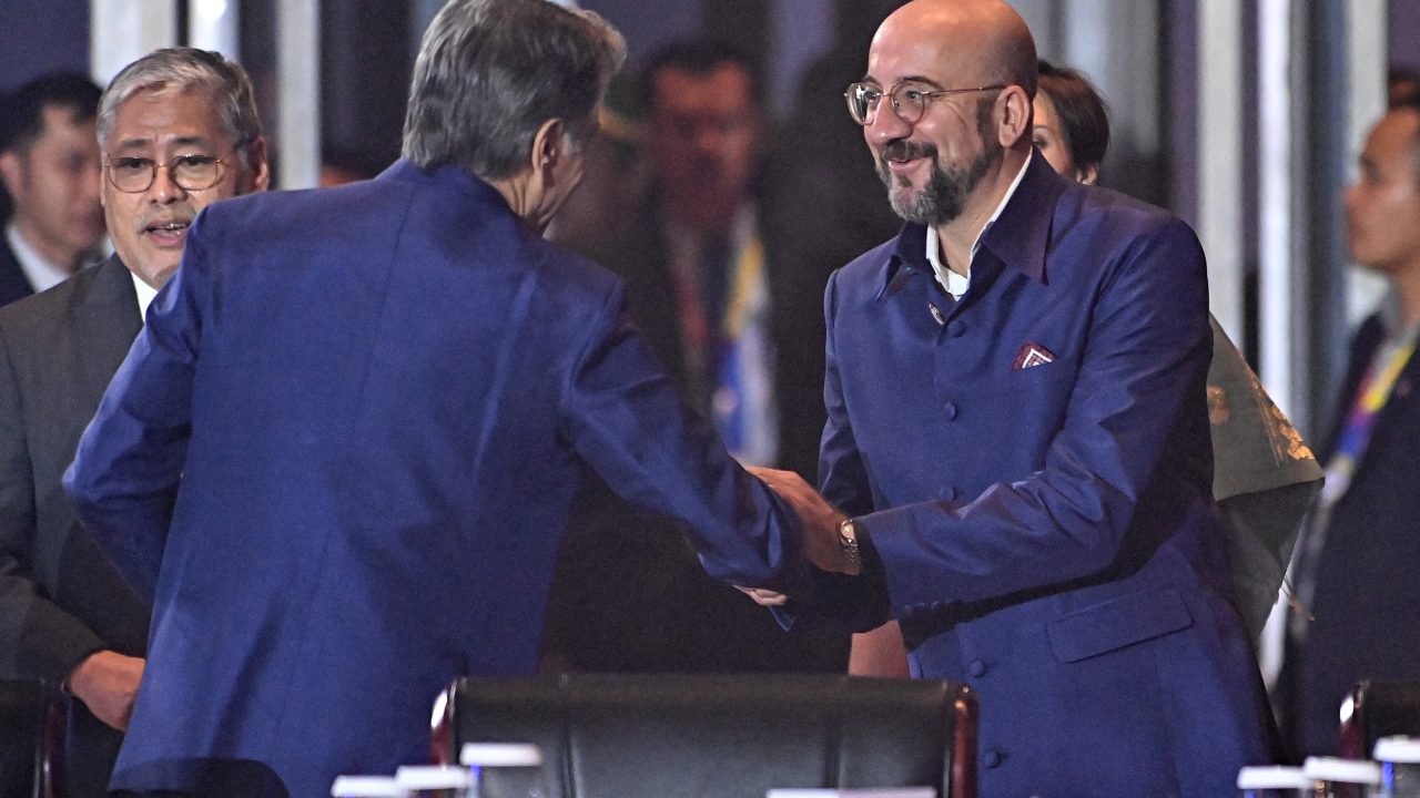 European Council President Charles Michel shakes hands with U.S. Secretary of State Antony Blinken during the Association of Southeast Asian Nations summit in Laos on October 10. (Photo: Tang Chhin Sothy/Pool via REUTERS)