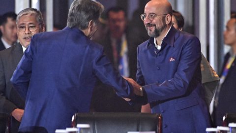 European Council President Charles Michel shakes hands with U.S. Secretary of State Antony Blinken during the Association of Southeast Asian Nations summit in Laos on October 10. (Photo: Tang Chhin Sothy/Pool via REUTERS)