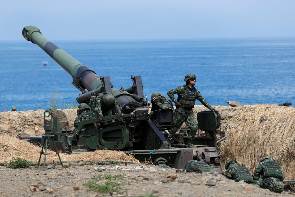 Female soldiers of an artillery unit take part in the live fire Han Kuang military exercise which simulates China s People s Liberation Army PLA invading the island in Pingtung