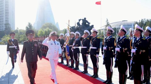 FILE PHOTO: North Korea s Army General Kim Su Gil and China s Admiral Miao Hua review the honour guard