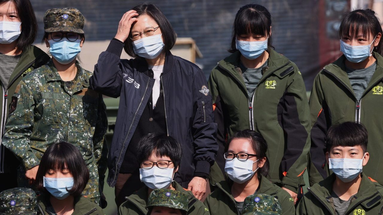 Taiwan President Tsai Ing wen takes photos with female soldiers in Tainan