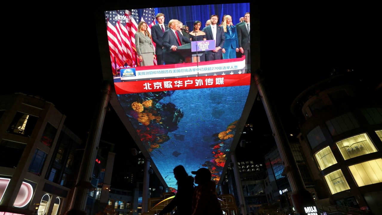 Screen displays news bulletin on the U S election at a shopping complex in Beijing
