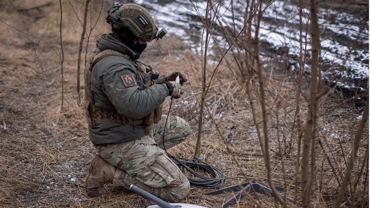 A Ukrainian soldier prepares a Starlink system at his position on the front line near the town of Avdiivka on February 20. (Photo: Inna Varenytsia/Reuters)