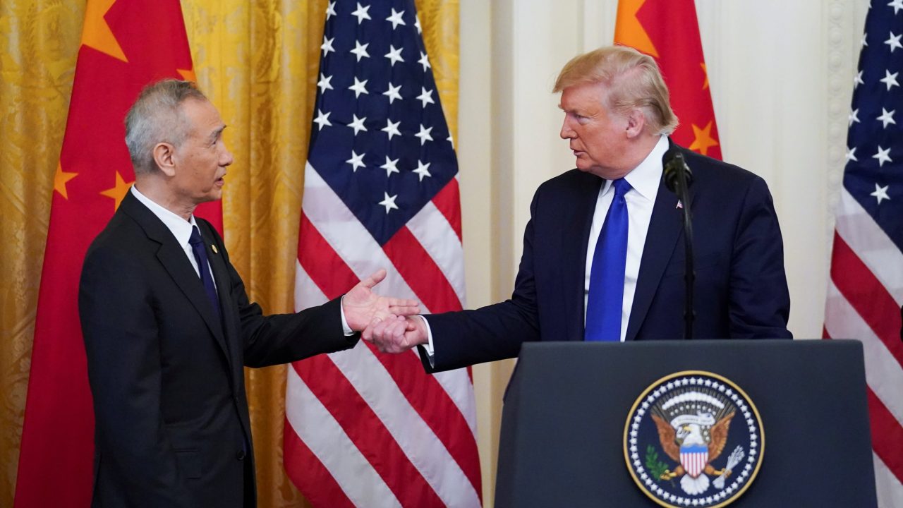 Chinese Vice Premier Liu He reaches out to U S President Donald Trump during U S China trade signing ceremony at the White House in Washington
