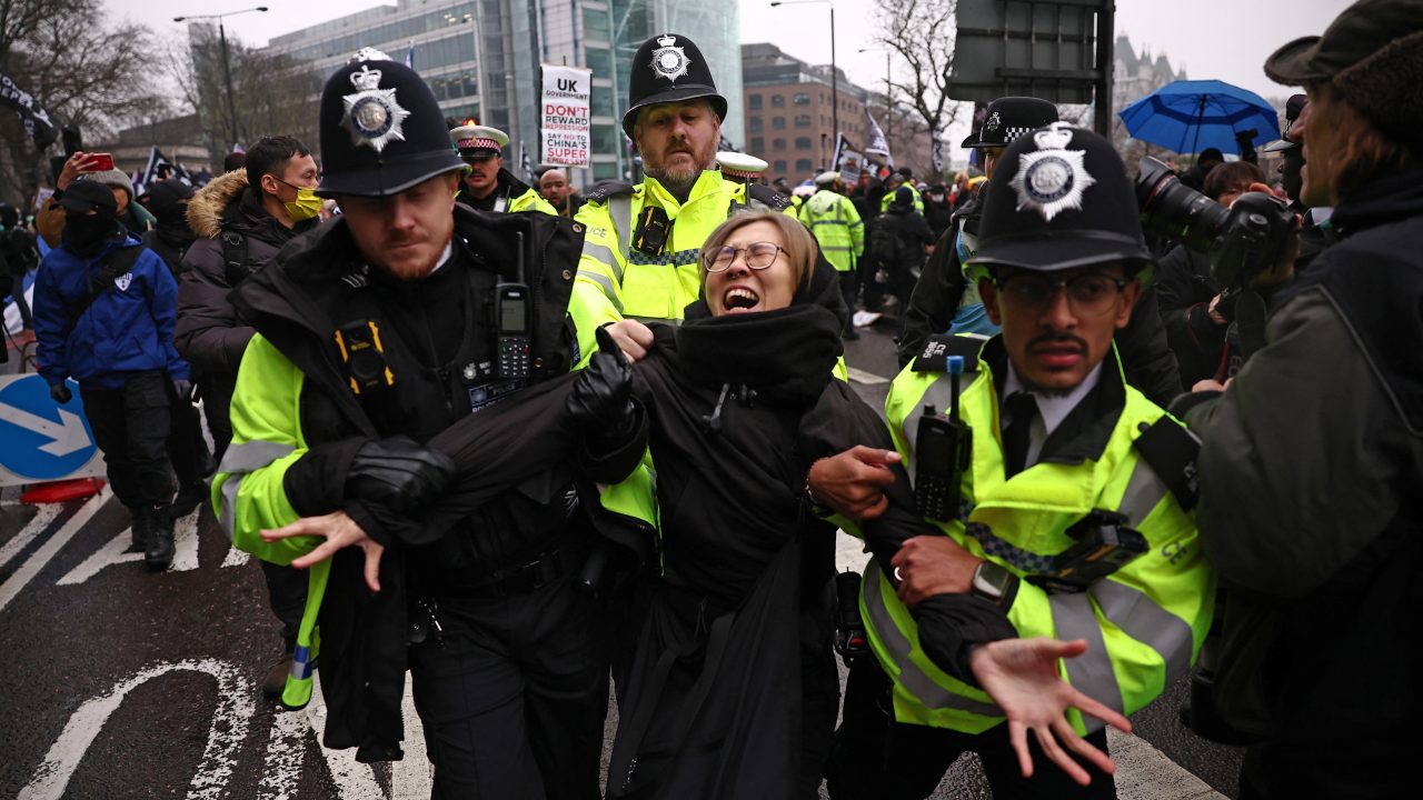Police officers take away a protester who was attempting to block the road during a gathering at the site of the former Royal Mint on February 8 to demonstrate against a proposal to move China’s embassy to this site, a stones throw from The Tower of London. (Photo: Henry Nicholls/AFP)
