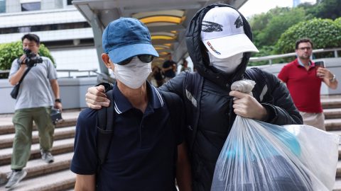 Kwok Yin-sang, father of pro-democracy activist Anna Kwok, leaves court in Hong Kong on May 20 after charges for allegedly handling her financial assets. (Photo: Tyrone Siu/Reuters)