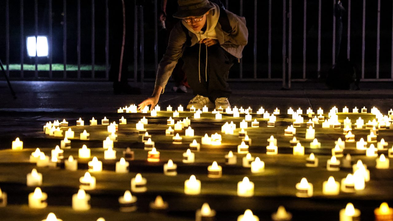 A man places a candle at Liberty Square in Taipei to mark the 36th anniversary of China’s Tiananmen Square crackdown. (Photo: I-Hwa Cheng/AFP)